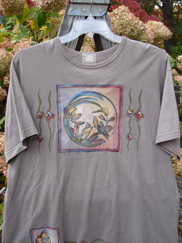 1999 Short Sleeved Tee Circle Bloom Shale Size 1 featuring a super circle bloom theme painting on the front, a thinner slightly rolled ribbed neckline, and a fairly straighter shape.