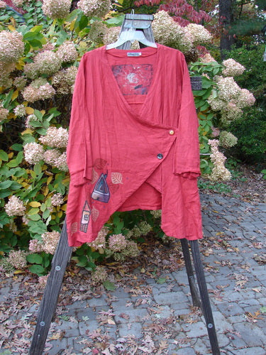 Barclay Linen Tidal Jacket with a Home Swing theme on a rack, featuring a deeper neckline, two-button side closure, and varying front hemline, displayed in Geisha's Robe Altered Size 0.