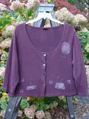 Barclay Textured Cotton Knit Crop Box Sweater Travel in Deep Rose, Size 0, featuring a wide neckline, button closure, cozy sleeves, and travel-themed paint accents.