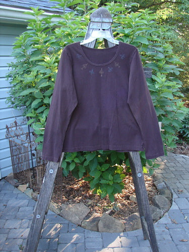 1999 Cotton Lycra Long Sleeved Layering Top Necklace Deep Burgundy Size 2 displayed on a clothes rack, showcasing its full-length sleeves and super stretch fabric.