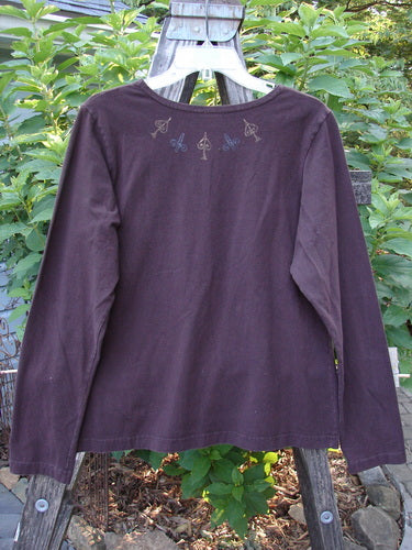 1999 Cotton Lycra Long Sleeved Layering Top Necklace Deep Burgundy Size 2 displayed on a hanger, showcasing its full-length sleeves and sleek, stretchy fabric, perfect for layering.