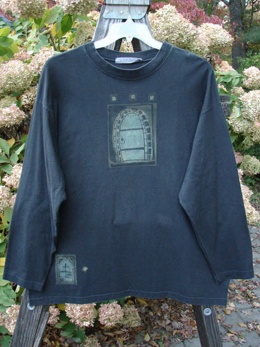 1997 Long Sleeved Tee Stone Door Cast Iron Size 1; features mid-weight organic cotton, wider ribbed neckline, drop shoulders, longer sleeves, square box shape, and painted stone door graphic on the front.