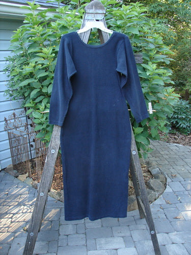 1991 Rib Thermal The Skinny Dress Unpainted Charcoal Altered OSFA displayed on a wooden ladder, showcasing its straight linear shape, long sleeves, rounded neckline, and cozy cotton thermal rib fabric.