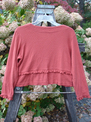 2000 Wool Pointelle Annu Jacket Unpainted Bittersweet Size 0 displayed on a wooden stand, showcasing its flared cropped shape, lettuce-edged accents, two front pockets, and eyelet cut design.