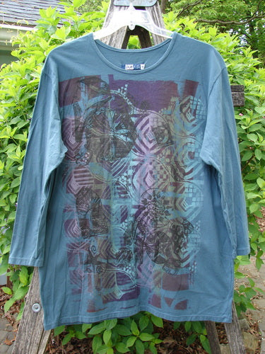 Barclay Long Sleeved Studio Tee Flower Garden Block Tealen Size 0 features abstract geometric prints on a teal-green T-shirt, showcasing long sleeves and a straight, boxy silhouette, perfectly capturing Bluefishfinder.com's vintage style.