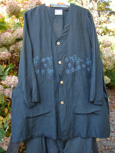 2000 Hemp Silk Continuous Garden Duo Domino Size 2: A blue shirt with flowers on it and a button, part of the Spring Collection.