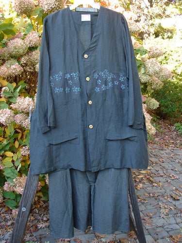 Image alt text: "2000 Hemp Silk Continuous Garden Duo Domino Size 2: Blue pajamas on a swinger, blue shirt with flowers, close-up of person's pants, screw in wood piece"