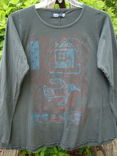 Barclay Long Sleeved Cafe Tee, Love Dove Home Grey Hunter Size 0, features stylized motifs of a house, bird, and planters on organic cotton, displayed on a hanger with curly hem details.