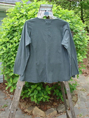 Barclay Long Sleeved Cafe Tee Love Dove Home Grey Hunter Size 0 displayed on a clear hanger over a stepladder, featuring a rounded neckline and curly edges, from Bluefishfinder.com.
