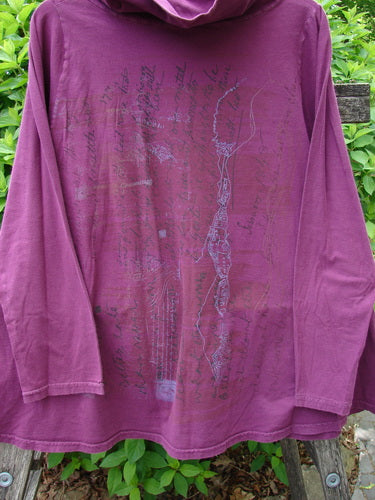 Barclay Cowl Neck Long Sleeved A Line Top Rock Note Merlot Size 0, featuring a subtle map-like graphic, draped on a bench with foliage backdrop, showcasing cozy sleeves and unique curly edgings.