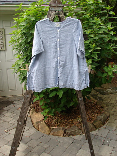 1999 Handkerchief Linen Camp Shirt Unpainted Stream Size 1 displayed on a wooden ladder, showcasing its A-line shape, tiny vented sides, and small original coordinating buttons.
