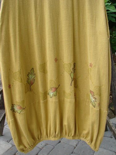 2000 Cotton Hemp Libby Jumper with Falling Leaf Gold pattern, altered size 1, featuring a downward scooped waistline, two side pockets, lower bubbled shape, and an elastic hemline.
