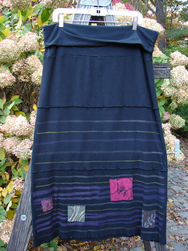 Barclay Patched Thermal Fold Over Pencil Panel Skirt Grid Stripe Black Size 2 on a clothes rack, showcasing a fold-over waistline, horizontal stitchery, and tiny patches along the hem panel.