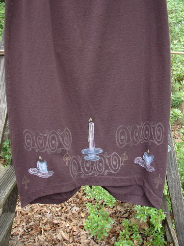 1999 Winter Skirt Candle Deep Burgundy Size 0 displayed on a brown towel with candles, highlighting its pegged lower shape and scooped front hemline.