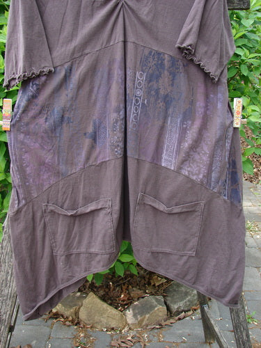 Barclay Perfect Day Pocket Tunic Dress Garden Gate Deep Woods Size 0, featuring short sleeves, a gathered yoke, large patch pockets, and faint stripes, displayed on a wooden frame with foliage backdrop.
