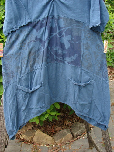 Barclay Perfect Day Pocket Tunic Dress Sweet Pea Echo Blue Size 0, featuring patchwork blue panels with floral motifs, asymmetrical hem, oversized pockets, and a shallow V-neckline, embodying artistic, vintage style.