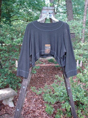 2000 Patched Rayon Lycra Rib Overtop Charcoal Heather Size 1 displayed on a wooden ladder in an outdoor forest setting.