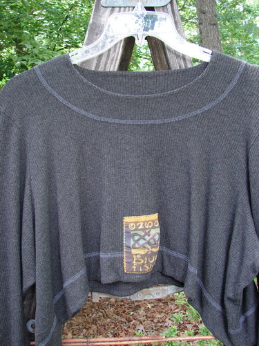2000 Patched Rayon Lycra Rib Overtop Charcoal Heather Size 1 featuring a dramatic upward scooping hemline and Celtic-themed painted patches, showcasing Blue Fish Clothing’s unique, layered look and superior craftsmanship.