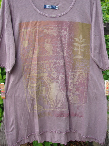 Barclay Slub Modal Three Quarter Sleeved Cafe Tee Merry Farm Mallow Size 0, featuring a delicate owl and plant graphic, is draped against a wooden fence, showcasing its lettuce-edge ruffled sleeves and neckline.