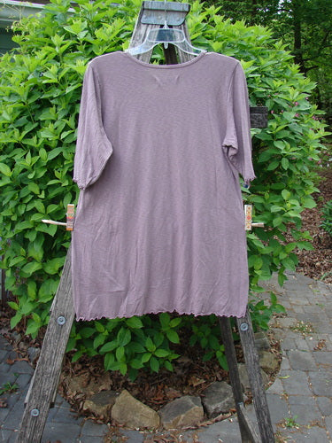 Barclay Slub Modal Three Quarter Sleeved Cafe Tee Merry Farm Mallow Size 0 displayed on a wooden ladder, showcasing its loose fit, rounded neckline, and three-quarter sleeves with curly edges.