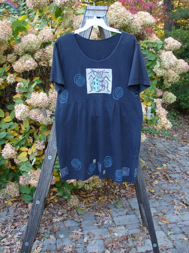 1992 Little Storma Dress with Garden Bug theme on wooden rack; features deep rounded neckline, gathered top half rear, and Blue Fish Vintage Patch.