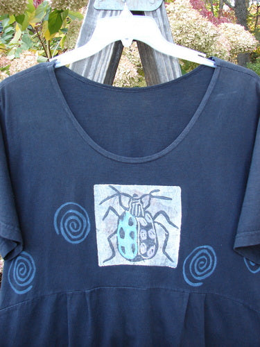 1992 Little Storma Dress Garden Bug Black Small OSFA featuring a blue shirt with a bug design, deep rounded neckline, gathered top half rear with slits, and a drop lower rear waist panel.