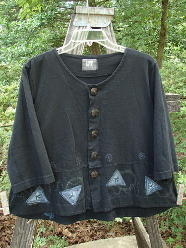 2000 4 Corners Jacket Travel Stone Black Size 1, featuring a flared shape with floral buttons and a leaf-themed design, perfect for layering.