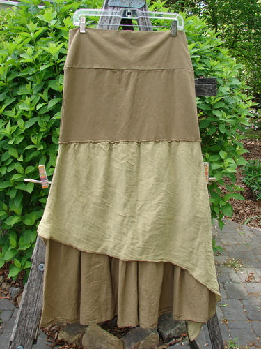 Barclay Fold Over Silk Accent Silhouette Skirt Unpainted Bone Size 0 displayed outdoors, showcasing its tiered, ankle-length design with earthy panels, clipped to a ladder against greenery, reflecting Bluefishfinder.com's vintage charm.