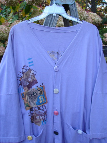 1997 Day Jacket Silly Pup Freesia Size 3 with brightly colored vintage buttons, V neckline, dolman sleeves, two front pockets, rounded front tails, and a scooped back hemline with drawcord.