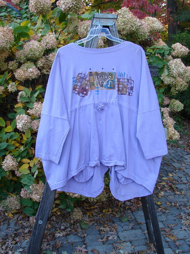 1997 Day Jacket Silly Pup Freesia Size 3 displayed on a hanger, featuring vintage buttons, two front pockets, dolman sleeves, V neckline, and unique painted accents.