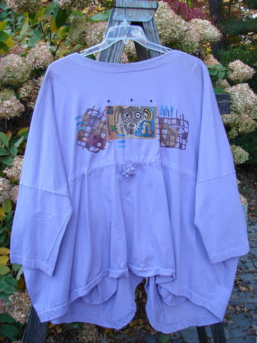 1997 Day Jacket Silly Pup Freesia Size 3 displayed on a hanger, featuring dolman sleeves, vintage buttons, front drop pockets, rounded tails, and a scooped back hemline with a playful pup theme painting.