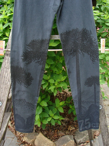 Barclay Cotton Lycra Relaxed Legging Shadow Tree Lux Silhouette Size 0 draped over a wooden ladder, featuring shadow tree prints on lower legs, embodying Bluefishfinder.com's unique vintage style.