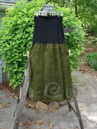 2000 Silk Organza Aios Dana Skirt Celtic Lichen Size 1 displayed on a ladder; features a black stretch upper and olive linen lower with spiral motifs, showcasing BlueFishFinder's vintage elegance.