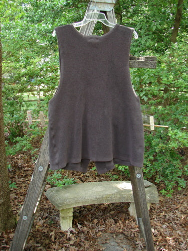 2000 Patched Celtic Moss Global Vest Brum Size 0 displayed on a wooden ladder, featuring 3 rubberized buttons, V neckline, deep arm openings, and a Blue Fish signature front lower patch.