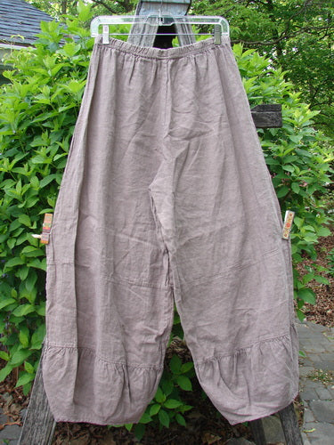 Barclay Linen Meadow Pant Celtic Vine Stone Oriel Size 0: Loose-fitting, taupe harem trousers with elastic waist, gathered panels, narrowing seams. Hanging outdoors, embodying Bluefishfinder's vintage-inspired, creative expression ethos.
