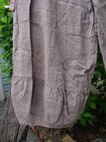Barclay Linen Meadow Pant Celtic Vine Stone Oriel Size 0, knee-length, lightweight linen with a gathered tier hem, hanging outdoors. Features wide flowy shape, elastic waist, and Celtic vine stone theme.