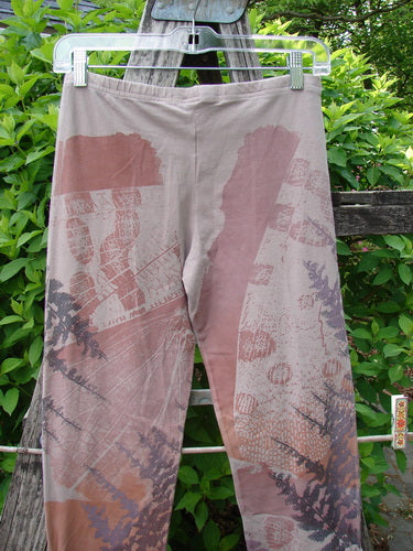 Barclay Cotton Lycra Side Gather Legging Forest Moon Oriel Size 0, featuring an abstract map-like print with gridlines and foliage, hangs outdoors, showcasing its slim fit and tapering design with exterior drawcords.