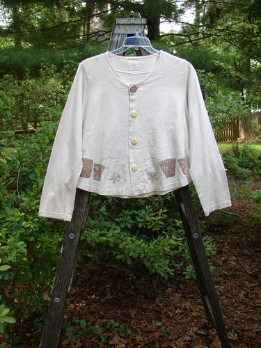 1999 Coffee Top Flowerpot Tea Dye Size 1 displayed on a wooden stand, showcasing its rounded hemline, big button closures, and drawcord back.