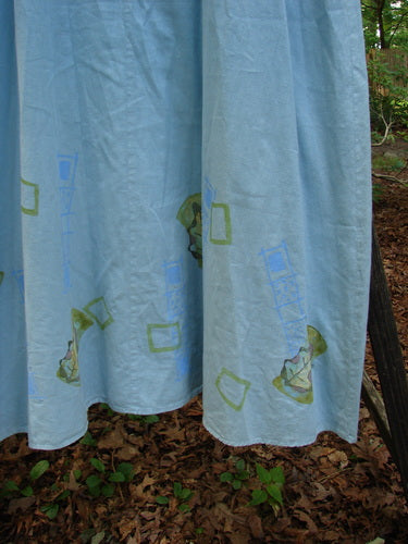 2000 Strappy Jumper Leaf Path Blue Jet Size 1 features a blue sheet with intricate green and blue designs, adjustable pearl buttons, and a flared A-line shape with a scooped neckline from Bluefishfinder.com.