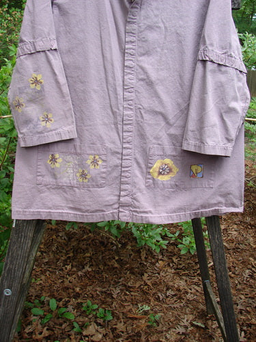 2000 Parachute Camper Jacket Florals Pale Purple Size 0, featuring a floral pattern, full snap line, four painted front pockets, and detachable sleeves.