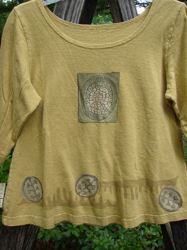 2000 Cotton Hemp Theo Top Center Gold Size 0, featuring a circular design, three-quarter sleeves, rounded neckline, and a-line shape. From the Blue Fish Resort Collection 2000, in perfect condition.