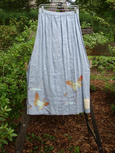 1999 Handkerchief Linen Blossom Skirt Butterfly Water Size 1, featuring a blue skirt adorned with delicate butterfly designs, full elastic waistline, and graceful draping for a dreamy, flowing movement.