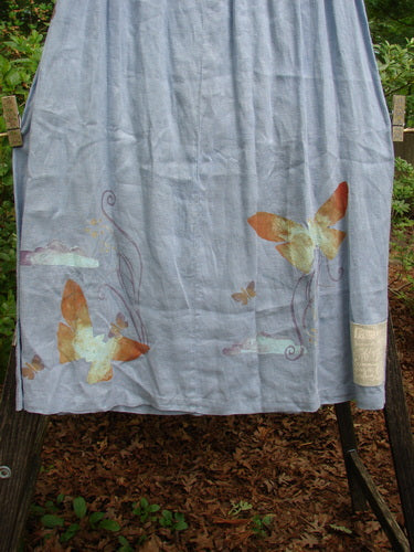 1999 Handkerchief Linen Blossom Skirt Butterfly Water Size 1, featuring a flowing blue fabric with butterfly designs, full elastic waistline, and a gradual widening shape for a dreamy, breezy drape.