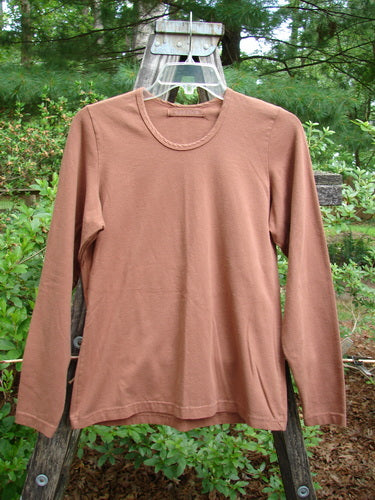 1997 Cotton Lycra Long Sleeved Layering Top Unpainted Copper Size 1 displayed on a hanger, showcasing a rounded shallow neckline, tapering waist, and slight lower flair.