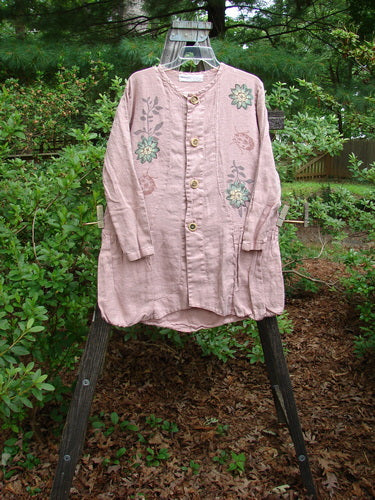 1998 Botanical Meadow Jacket Ladybug Floral Mallow Altered Size 1 displayed on a wooden stand, showcasing its botanical and ladybug-themed paint, ceramic buttons, and detailed flounce hem in an outdoor setting.