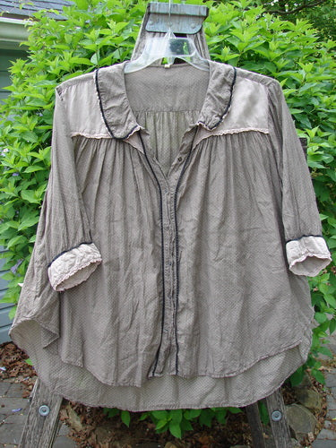 Magnolia Pearl Silk Cotton Poet's Billow Blouse Blue Grey Shore OSFA: A lightweight, loose-fitting blouse with a rounded laced collar, billowy sleeves, and a subtle all-over pattern, hanging outdoors.
