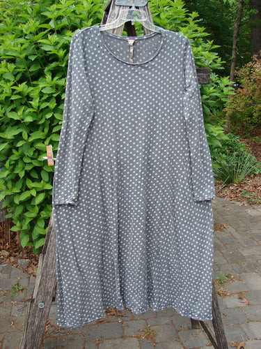 Magnolia Pearl Cotton Dylan Dress Ozzy Tiny Continuous Polka OSFA on a wooden frame, showcasing its polka-dot print, rolled neckline, and distressed seams, embodying Bluefishfinder.com's vintage and expressive style.