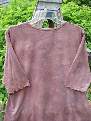 Barclay Cotton Lycra Three Quarter Sleeved A Line Tee hangs outdoors, showcasing its unique A-line shape, rounded neckline, and curly edges, reflecting Bluefishfinder.com's vintage-inspired, expressive style.