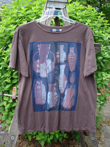 Barclay Short Sleeved Fiona Straight Tee with stylized vase graphic, Redwood size 0, displayed on a stepladder, exemplifying Bluefishfinder.com's vintage, artistic clothing ethos.