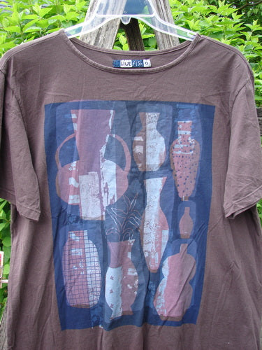 Barclay Short Sleeved Fiona Straight Tee Modern Vase Redwood Size 0 features a unique graphic of abstract vases in muted tones, highlighting its artistic flair. The T-shirt showcases a rounded neckline and shorter wide sleeves.